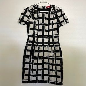 HUGO BOSS. Never been worn.  Above knees for 5.2 figure.